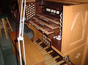 The organ console at , , .  The stop knobs on this console are placed to the left and right of the keyboards.