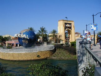 Taken in December 2004, this picture shows a walkway bridge (right) and the giant studio entrance (back) at Universal Studios Orlando.