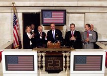  U.S.   rings the opening bell at the NYSE on April 23, 2003. Former chairman  can also be seen in this picture.