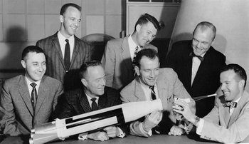The "Mercury seven" astronauts pose with an Atlas model July 12, 1962.