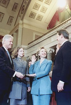 Hillary Clinton is sworn in as a U.S. Senator by Vice President Gore as Bill and  observe.