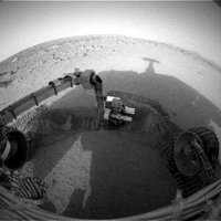 NASA's Mars Exploration Rover Spirit casts a shadow over the trench that the rover is examining with tools on its robotic arm. Spirit took this image with its front hazard-avoidance camera on , , during the rover's 48th martian day, or .