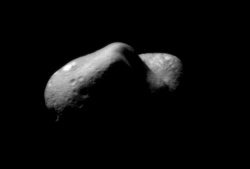 This picture of Eros shows the view looking from one end of the asteroid across the gouge on its underside and toward the opposite end.