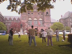 People practicing Falun Gong exercises outside of Queen's Park, Toronto, Ontario