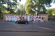 campaigners working on posters in Milan, Italy, 2004