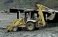 A common backhoe-loader. The backhoe is on the right, the bucket/blade on the left.