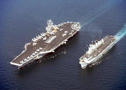 Two aircraft carriers,  (left), and  (right), showing the difference in size between a  and a light  aircraft carrier.