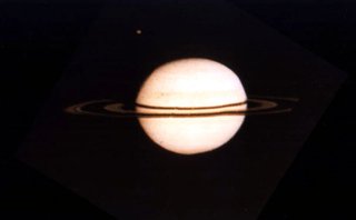 One of the first spacecraft views of  was taken by Pioneer 11 on , , three days before its closest encounter. The   is visible to the upper left.