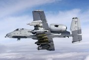 An A-10 Thunderbolt II in flight fully loaded with armaments