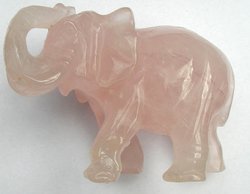 An elephant carved in rose quartz, 4 inches (10 cm) long