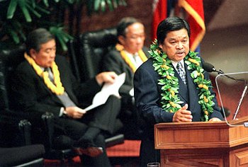 Hawaii Governor Benjamin J. Cayetano speaks before a special session of the legislature on January 24, 2000. Behind him are Senate President Norman Mizuguchi and House Speaker Calvin Say.