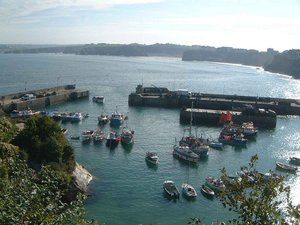 Newquay harbour with some of the surfing beaches in the background.