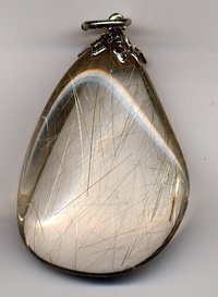 Rutilated quartz pendant. The needle-like crystals of rutile can be seen inside the quartz.