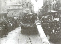 Polish Tanks greeted by cheering crowds, enter .