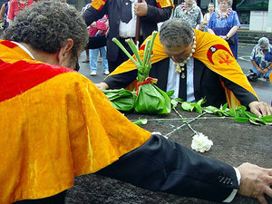 Members of the Royal Order of Kamehameha I participate in a ceremonial cleansing ritual at Naha Stone on the Big Island of Hawai'i on November 14, 2003 to honor the memory of their ancestors.