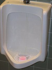 Urinal with urinal cake.