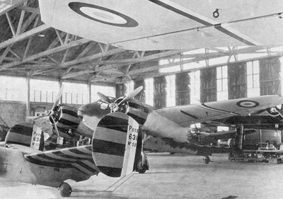 A Potez 63.11 reconnaissance aircraft and a Breguet 695 bomber sporting the red and yellow stripes demanded by the Germans for the aircraft of the Vichy French air force, which would cease to exist on December 1, 1942, a week after the Germans invaded the then-unoccupied part of France