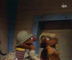 Ernie, on tour through Africa with Bert, meets an Egyptian statue counterpart to dance with.