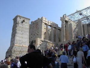 Crowds of tourists climb the steps to the Propylaea, gateway to the Acropolis, Athens