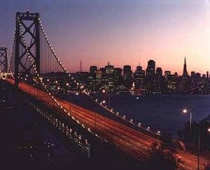 The Bay Bridge, with the skyline of San Francisco in the background.