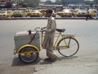 A vendor on a Tricycle & Taxis