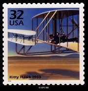 USPS stamp depicting the "first flight."