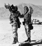 Two soldiers preparing to fire a shoulder-mounted Stinger missile launcher
