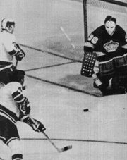 Barry Wilkins scores the first goal in Canucks history against the .  The Canucks would unfortunately lose the game 3-1.