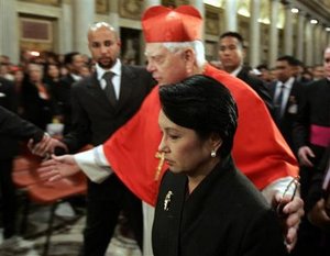 As archpriest the Basilica di Santa Maria Maggiore in Rome, Bernard Cardinal Law had the honors of presiding over one of nine official masses of mourning after the funeral of Pope John Paul II. He escorts Philippines President Gloria Macapagal Arroyo in this photo.