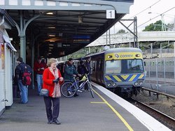 A city-bound   train arrives at platform 1