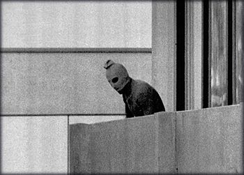 One of the Black September kidnappers on the balcony of the Israeli hostel at the Olympic village