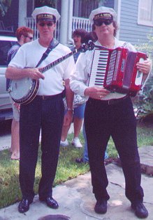 Musician on right holds a piano-accordion (on left a )