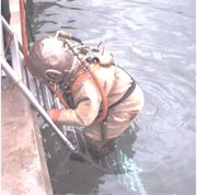 Hardhat diver entering water at Stoney Cove, England