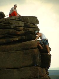 Rock climbers on Stanage Edge in the Peak District.