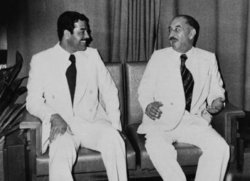 Saddam Hussein talking with Ahmed Hassan al-Bakr