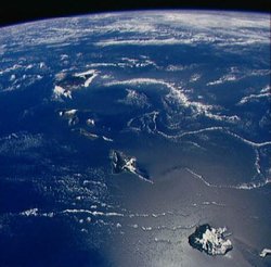 Photograph of the Hawaiian Islands from , looking southeast by south. Kaua‘i is closest at bottom right