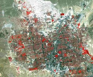 Las Vegas viewed in false color, from 438 miles (705 km) by TERRA satellite. Grass-covered land, such as golf courses, appears in red.  The picture bottom is just south of  Sunset road and the airport, the Spring Mountains on the West and Sunrise Mountain on the East