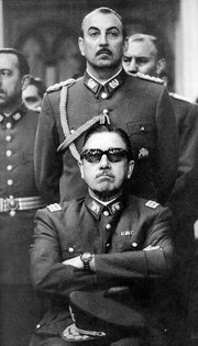 Pinochet (seated) as Chairman of the Junta following the coup (1973)