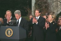 Al Gore stands in support of President Clinton while he is reaffirming his intentions to not resign from office during the  process.  Later during Gore's campaign for President, he tried to distance himself from the scandal ridden Clinton.