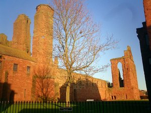 The ruined , built from local red .