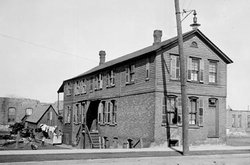  This building was used to mint counterfeit American  in the late  and/or early . The picture was taken in  and featured in a  newspaper.