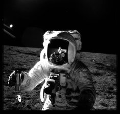 Alan Bean pictured by Pete Conrad (echoed in Bean's helmet) (NASA)