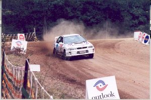 A Subaru Impreza WRX competing in a rally.